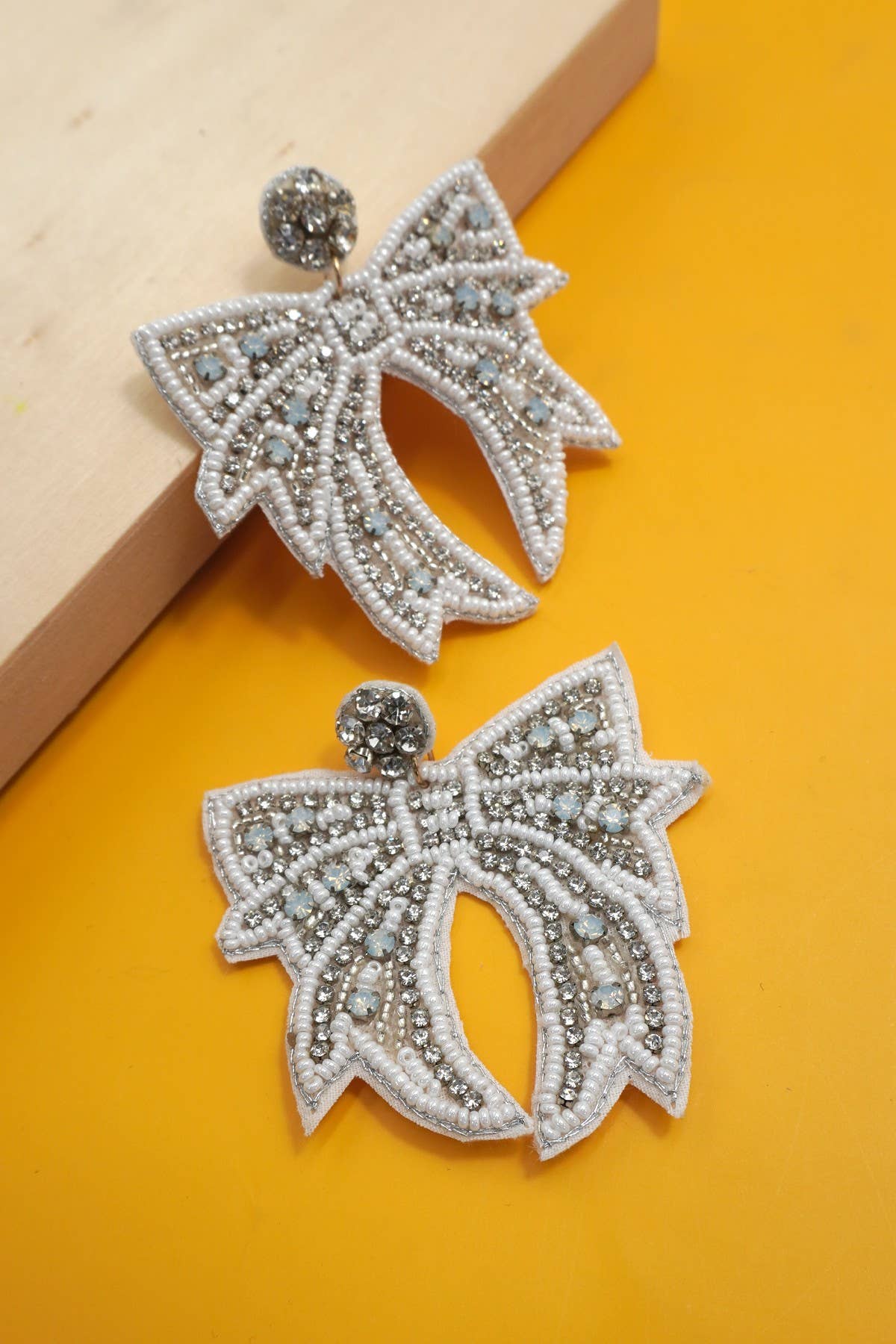 CHRISTMAS HOLIDAY WHITE BOW BEADED EARRINGS